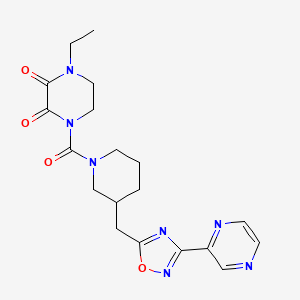 molecular formula C19H23N7O4 B2749729 1-Ethyl-4-(3-((3-(pyrazin-2-yl)-1,2,4-oxadiazol-5-yl)methyl)piperidine-1-carbonyl)piperazine-2,3-dione CAS No. 1704536-39-9
