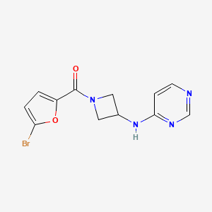 molecular formula C12H11BrN4O2 B2750525 N-[1-(5-bromofuran-2-carbonyl)azetidin-3-yl]pyrimidin-4-amine CAS No. 2097918-12-0