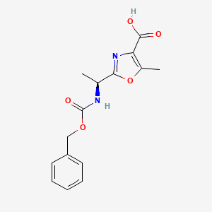 molecular formula C15H16N2O5 B2752671 2-[(1S)-1-{[(苄氧基)羰基]氨基}乙基]-5-甲基-1,3-噁唑-4-甲酸 CAS No. 521096-39-9