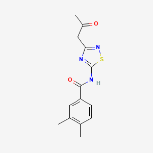 molecular formula C14H15N3O2S B2754861 3,4-dimethyl-N-[3-(2-oxopropyl)-1,2,4-thiadiazol-5-yl]benzamide CAS No. 1255785-13-7