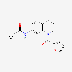 molecular formula C18H18N2O3 B2757558 N-[1-(2-furoyl)-1,2,3,4-tetrahydroquinolin-7-yl]cyclopropanecarboxamide CAS No. 946265-40-3