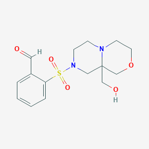 2-[[9a-(Hydroxymethyl)-1,3,4,6,7,9-hexahydropyrazino[2,1-c][1,4]oxazin-8-yl]sulfonyl]benzaldehyde