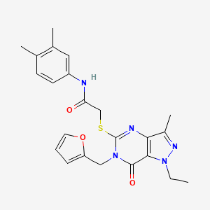 molecular formula C23H25N5O3S B2766417 N-(3,4-dimethylphenyl)-2-({1-ethyl-6-[(furan-2-yl)methyl]-3-methyl-7-oxo-1H,6H,7H-pyrazolo[4,3-d]pyrimidin-5-yl}sulfanyl)acetamide CAS No. 1358374-71-6