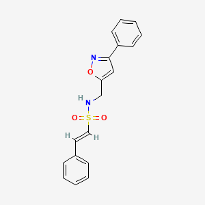 molecular formula C18H16N2O3S B2767407 (E)-2-phenyl-N-[(3-phenyl-1,2-oxazol-5-yl)methyl]ethenesulfonamide CAS No. 1312000-42-2