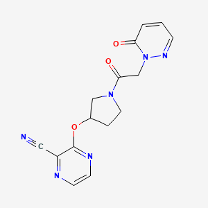 molecular formula C15H14N6O3 B2769975 3-((1-(2-(6-氧代吡啶-1(6H)-基)乙酰)吡咯烷-3-基)氧基)吡嗪-2-基甲腈 CAS No. 2034282-43-2