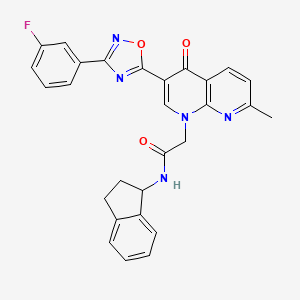 N-(2,3-dihydro-1H-inden-1-yl)-2-(3-(3-(3-fluorophenyl)-1,2,4-oxadiazol-5-yl)-7-methyl-4-oxo-1,8-naphthyridin-1(4H)-yl)acetamide