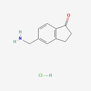 molecular formula C10H12ClNO B2771329 5-(Aminomethyl)-2,3-dihydro-1H-inden-1-one hydrochloride CAS No. 2172488-42-3