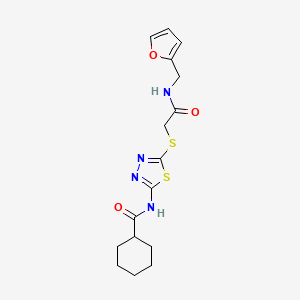 molecular formula C16H20N4O3S2 B2772032 N-[5-[2-(呋喃-2-基甲基氨基)-2-氧代乙基]硫代-1,3,4-噻二唑-2-基]环己烷甲酰胺 CAS No. 868972-94-5