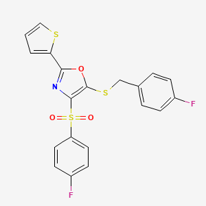 molecular formula C20H13F2NO3S3 B2772354 5-((4-Fluorobenzyl)thio)-4-((4-fluorophenyl)sulfonyl)-2-(thiophen-2-yl)oxazole CAS No. 850927-92-3
