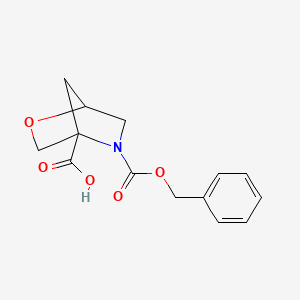 molecular formula C14H15NO5 B2773304 5-Phenylmethoxycarbonyl-2-oxa-5-azabicyclo[2.2.1]heptane-4-carboxylic acid CAS No. 2248267-77-6