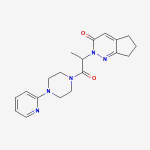 molecular formula C19H23N5O2 B2774147 2-(1-oxo-1-(4-(pyridin-2-yl)piperazin-1-yl)propan-2-yl)-6,7-dihydro-2H-cyclopenta[c]pyridazin-3(5H)-one CAS No. 2097900-24-6
