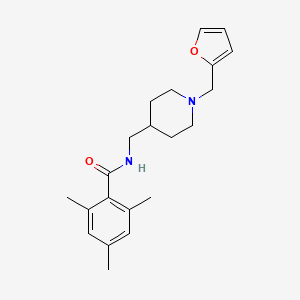 N-((1-(furan-2-ylmethyl)piperidin-4-yl)methyl)-2,4,6-trimethylbenzamide