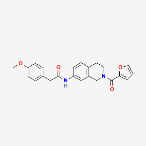 N-(2-(furan-2-carbonyl)-1,2,3,4-tetrahydroisoquinolin-7-yl)-2-(4-methoxyphenyl)acetamide