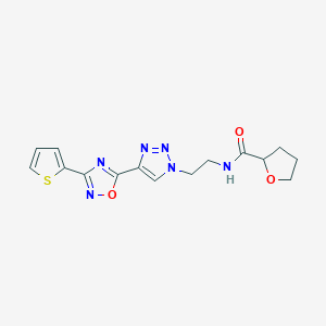 molecular formula C15H16N6O3S B2778947 N-(2-(4-(3-(thiophen-2-yl)-1,2,4-oxadiazol-5-yl)-1H-1,2,3-triazol-1-yl)ethyl)tetrahydrofuran-2-carboxamide CAS No. 2034346-07-9