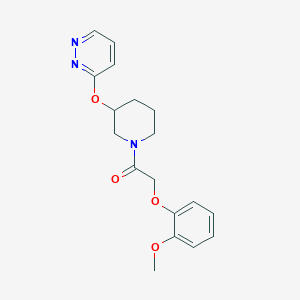 2-(2-Methoxyphenoxy)-1-(3-(pyridazin-3-yloxy)piperidin-1-yl)ethanone