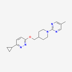 molecular formula C18H23N5O B2787199 2-[4-[(6-Cyclopropylpyridazin-3-yl)oxymethyl]piperidin-1-yl]-5-methylpyrimidine CAS No. 2379972-53-7