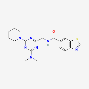 molecular formula C19H23N7OS B2787495 N-((4-(dimethylamino)-6-(piperidin-1-yl)-1,3,5-triazin-2-yl)methyl)benzo[d]thiazole-6-carboxamide CAS No. 2034550-26-8