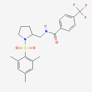molecular formula C22H25F3N2O3S B2787986 N-((1-(mesitylsulfonyl)pyrrolidin-2-yl)methyl)-4-(trifluoromethyl)benzamide CAS No. 896281-26-8