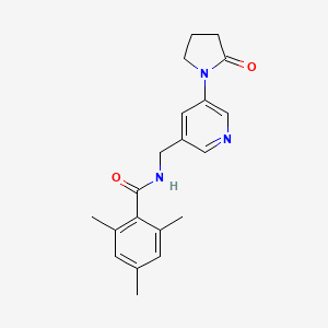 B2789552 2,4,6-trimethyl-N-{[5-(2-oxopyrrolidin-1-yl)pyridin-3-yl]methyl}benzamide CAS No. 2097892-07-2