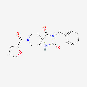 3-Benzyl-8-(tetrahydrofuran-2-carbonyl)-1,3,8-triazaspiro[4.5]decane-2,4-dione