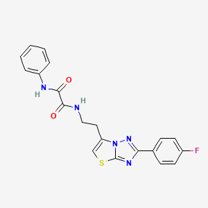 molecular formula C20H16FN5O2S B2793584 N1-(2-(2-(4-fluorophenyl)thiazolo[3,2-b][1,2,4]triazol-6-yl)ethyl)-N2-phenyloxalamide CAS No. 894033-39-7