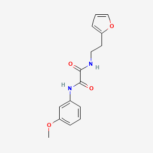 molecular formula C15H16N2O4 B2794361 N-[2-(furan-2-yl)ethyl]-N'-(3-methoxyphenyl)oxamide CAS No. 898374-09-9