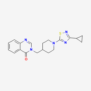 molecular formula C19H21N5OS B2797030 3-[[1-(3-Cyclopropyl-1,2,4-thiadiazol-5-yl)piperidin-4-yl]methyl]quinazolin-4-one CAS No. 2380087-06-7