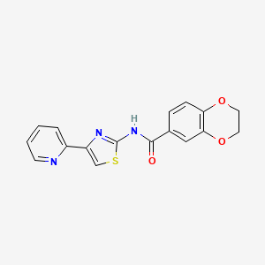 molecular formula C17H13N3O3S B2798041 N-(4-(pyridin-2-yl)thiazol-2-yl)-2,3-dihydrobenzo[b][1,4]dioxine-6-carboxamide CAS No. 477551-65-8