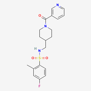 molecular formula C19H22FN3O3S B2799705 4-fluoro-2-methyl-N-((1-nicotinoylpiperidin-4-yl)methyl)benzenesulfonamide CAS No. 1396747-37-7