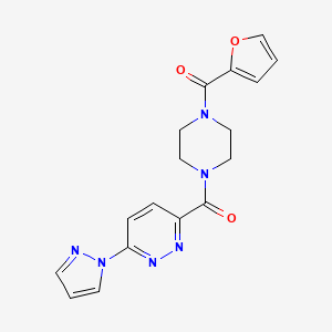 molecular formula C17H16N6O3 B2801018 3-[4-(furan-2-carbonyl)piperazine-1-carbonyl]-6-(1H-pyrazol-1-yl)pyridazine CAS No. 1351652-31-7