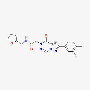molecular formula C20H23N5O3 B2802603 2-[2-(3,4-dimethylphenyl)-4-oxopyrazolo[1,5-d][1,2,4]triazin-5(4H)-yl]-N-(tetrahydrofuran-2-ylmethyl)acetamide CAS No. 1020969-46-3