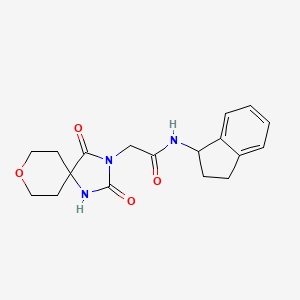 molecular formula C18H21N3O4 B2802775 N-(2,3-二氢-1H-茚基)-2-(2,4-二氧代-8-氧代-1,3-二氮杂螺[4.5]癸-3-基)乙酰胺 CAS No. 1775529-16-2