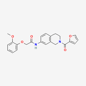 molecular formula C23H22N2O5 B2802897 N-(2-(furan-2-carbonyl)-1,2,3,4-tetrahydroisoquinolin-7-yl)-2-(2-methoxyphenoxy)acetamide CAS No. 955760-53-9