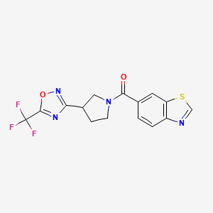 molecular formula C15H11F3N4O2S B2805789 Benzo[d]thiazol-6-yl(3-(5-(trifluoromethyl)-1,2,4-oxadiazol-3-yl)pyrrolidin-1-yl)methanone CAS No. 2034351-65-8