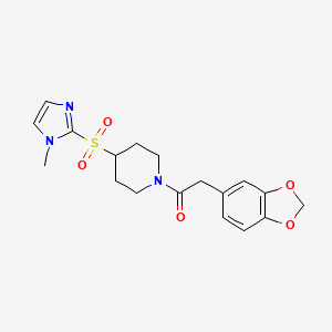 molecular formula C18H21N3O5S B2806590 2-(benzo[d][1,3]dioxol-5-yl)-1-(4-((1-methyl-1H-imidazol-2-yl)sulfonyl)piperidin-1-yl)ethanone CAS No. 2320465-04-9
