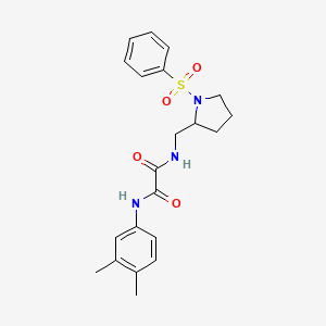 molecular formula C21H25N3O4S B2807271 N1-(3,4-dimethylphenyl)-N2-((1-(phenylsulfonyl)pyrrolidin-2-yl)methyl)oxalamide CAS No. 896270-24-9