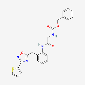 molecular formula C23H20N4O4S B2810543 Benzyl (2-oxo-2-((2-((3-(thiophen-2-yl)-1,2,4-oxadiazol-5-yl)methyl)phenyl)amino)ethyl)carbamate CAS No. 1705818-73-0