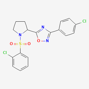 molecular formula C18H15Cl2N3O3S B2811074 3-(4-Chlorophenyl)-5-{1-[(2-chlorophenyl)sulfonyl]-2-pyrrolidinyl}-1,2,4-oxadiazole CAS No. 551930-99-5