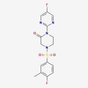 molecular formula C15H14F2N4O3S B2814670 4-(4-Fluoro-3-methylphenyl)sulfonyl-1-(5-fluoropyrimidin-2-yl)piperazin-2-one CAS No. 2309188-21-2