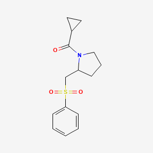 molecular formula C15H19NO3S B2816025 Cyclopropyl(2-((phenylsulfonyl)methyl)pyrrolidin-1-yl)methanone CAS No. 1448069-80-4