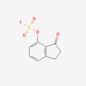 molecular formula C9H7FO4S B2816908 4-Fluorosulfonyloxy-3-oxo-1,2-dihydroindene CAS No. 2411268-71-6