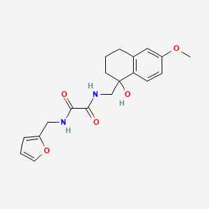 molecular formula C19H22N2O5 B2822022 N-[(furan-2-yl)methyl]-N'-[(1-hydroxy-6-methoxy-1,2,3,4-tetrahydronaphthalen-1-yl)methyl]ethanediamide CAS No. 1904017-61-3