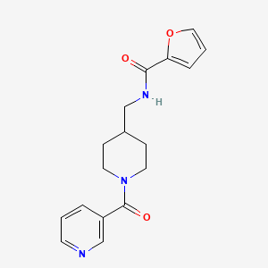 molecular formula C17H19N3O3 B2825680 N-((1-nicotinoylpiperidin-4-yl)methyl)furan-2-carboxamide CAS No. 1396747-78-6