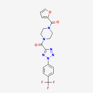 molecular formula C18H15F3N6O3 B2826407 (4-(furan-2-carbonyl)piperazin-1-yl)(2-(4-(trifluoromethyl)phenyl)-2H-tetrazol-5-yl)methanone CAS No. 1396626-10-0