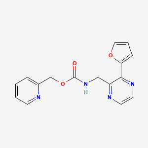 molecular formula C16H14N4O3 B2832786 吡啶-2-基甲基((3-(呋喃-2-基)吡嗪-2-基)甲基)氨基甲酸酯 CAS No. 2034301-28-3