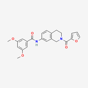 molecular formula C23H22N2O5 B2836058 N-(2-(furan-2-carbonyl)-1,2,3,4-tetrahydroisoquinolin-7-yl)-3,5-dimethoxybenzamide CAS No. 955665-32-4