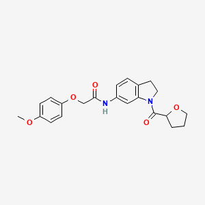 2-(4-methoxyphenoxy)-N-(1-(tetrahydrofuran-2-carbonyl)indolin-6-yl)acetamide