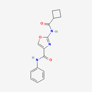 molecular formula C15H15N3O3 B2838654 2-(环丁基甲酰基)-N-苯基噁唑-4-甲酸酰胺 CAS No. 1396760-72-7