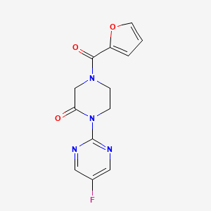 1-(5-Fluoropyrimidin-2-yl)-4-(furan-2-carbonyl)piperazin-2-one