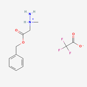 molecular formula C12H15F3N2O4 B2854243 1-[2-(Benzyloxy)-2-oxoethyl]-1-methylhydrazinium trifluoroacetate CAS No. 142683-68-9